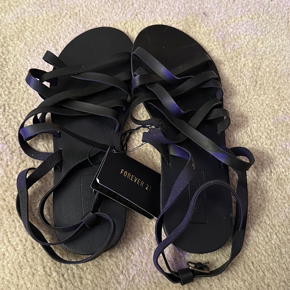 Brand new Forever 21 black criss-cross sandals. Size 8.